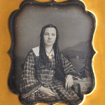 freckle-faced teenage girl with long ringlets, 1850s