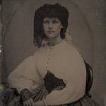 Lady wearing Swiss Waist and plaid Skirt, 1860s