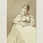 Mother in Meander trimmed Dress with Baby on her Lap, 1860s