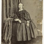 Girl in checkered Dress, ca. 1860-1865