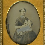 Woman breastfeeding a baby, ca. 1848