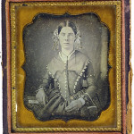 Woman with clasp handbag, ca. 1840s-1850
