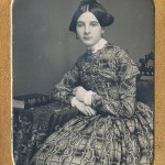 Lady with front laced bodice, 1840s