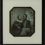 Couple in front of painted backdrop, ca. 1845