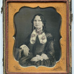 single-gloved Lady holding Daguerreotype Case, 1840s