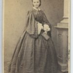 Teenage Girl in checkered dress, 1860s
