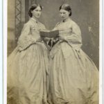 Sisters in identical dresses, 1860s