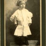 Boy in lace dress, ca. 1890s