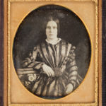 Lady in checkered dress, ca. 1850s