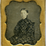 Girl in checkered dress, ca. 1850s
