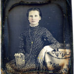 Girl holding Daguerreotype case, ca. 1850s