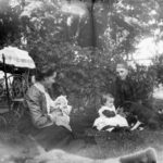 Two women with baby, toddler & dog, ca. 1890s-1900s