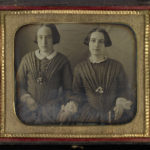 Young women in identical dresses, ca. 1840s