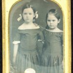 Two sisters in identical dresses, 1840s-50