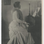Agnes Rand Lee playing the piano, 1895